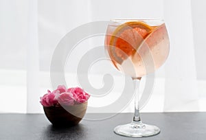 Close up pink pastel cocktail in tall glass on dreamy white background photo