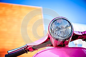 Close-up pink retro motorcycle