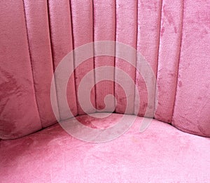 Close up of pink velvet fabric background texture, soft pastel pink textile