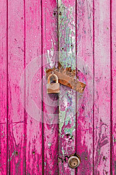 Close up of pink wooden door
