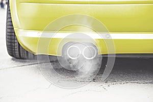 Close up on pipe exhaust car smoke emission