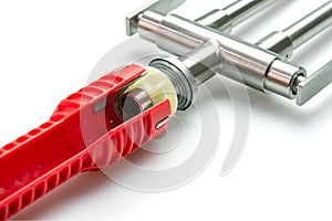 Close-up of Pipe wrench tool for repair sink strainers at a shallow depth of field