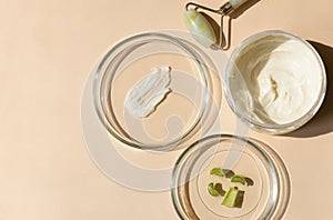 close-up of pipette and petri dish with facial serum gel