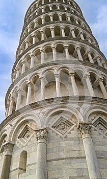 Close up of Pisa tower of Santa Maria Assunta cathedral