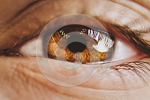 Close-up of planet earth in the eye of a child. View of a child on the environmental world.