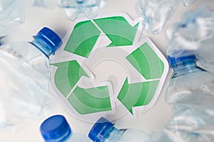 Close up of plastic bottles and recycling symbol