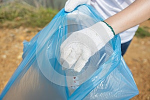 Close up Plastic box garbage in hand female volunteers, conducting environmental cooperation, saving world reducing global warming