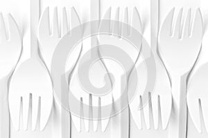 Close-up of plastic Forks. Flat lay pattern.
