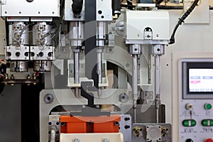 close up of plastic injection blow molding machine