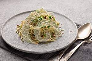 Close-up plate with cooked traditional Italian spaghetti aglio served