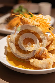 Close-up of a plate of Fried Pork in Scoop (or \