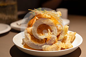 Close-up of a plate of Fried Pork in Scoop (or \