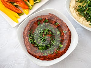 Close up of a plate with a spicy chickpea cream