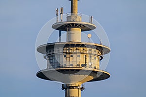 Close-up of the platform of a TV tower in front of a blue sky