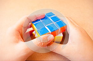 Close up play puzzle rubik cube