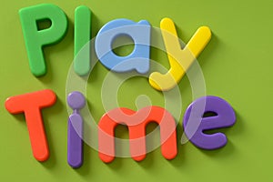 Close up of Play Time words in colorful plastic le