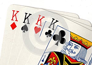 Close up of playing cards showing four kings.