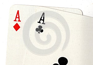 Close up of playing cards showing a pair of aces.