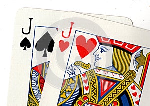 Close up of playing cards showing a pair of jacks.