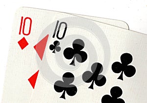 Close up of playing cards showing a pair of tens.