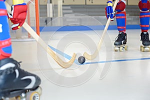 close up playing roller hockey