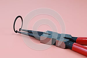 Close up Plier and retaining ring or circlip in working condition