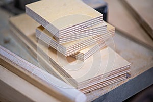 Close-up of plywood sheets at carpentry on wooden table