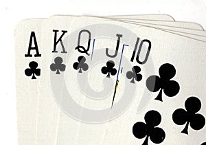 Close up of a poker hand of playing cards showing a royal flush.