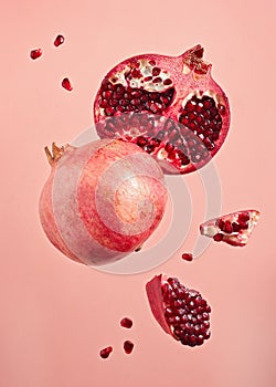 Close-Up Of Pomegranate Slices On Pink Background