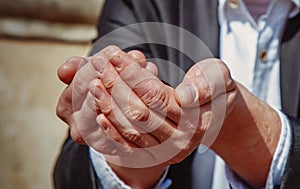 Close up poor man begging for help and asks for money as symbol of poverty, hunger, pain and bankruptcy