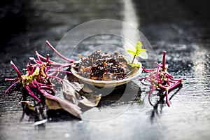 Close up of popular dish of amaranth leaves or chauli or chowli or chaulai or thotakura or harive soppu in a glass plate with raw