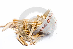 Close up of popular Indian and Asian ayurvedic herb i.e. Satavari or kurilo isolated on white in a glass bowl.