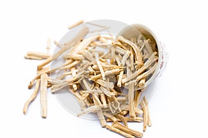 Close up of popular Indian and Asian ayurvedic herb i.e. Satavari or kurilo isolated on white in a glass bowl.