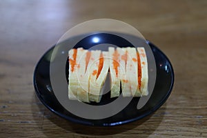 Close-up, popular Japanese food set, fresh sweet egg sushi, delicious to eat, good food concept.