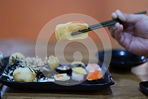 Close-up, popular Japanese food set, fresh sweet egg sushi, delicious to eat, good food concept.