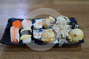 Close-up, popular Japanese food set, sushi, salmon rice ball, fresh sweet egg, delicious to eat, good food concept.