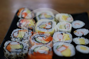 Close-up, popular Japanese food set, sushi, salmon rice ball, fresh sweet egg, delicious to eat, good food concept.