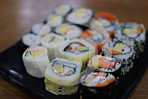Close-up, popular Japanese food set, sushi, salmon rice ball, fresh sweet egg, delicious to eat, good food concept.