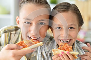 Porait of happy family eating pizza together photo