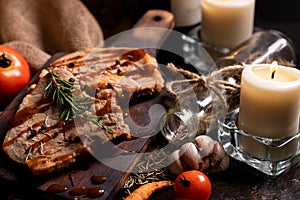 Close up pork chops steak with black pepper sauce placing on vintage wooden plate