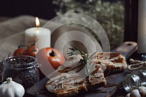 Close up of pork chops steak with black pepper sauce placing on vintage wooden plate