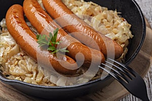 Close-up of pork sausages and sauerkraut