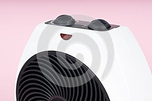 Close up of portable electric heater. Pink background