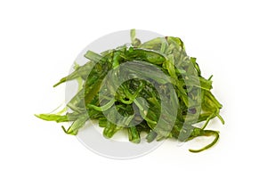 Close up portion of green wakame seaweed salad