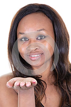 Close up portrait of african american woman afro blowing air kiss from open palm truthful love to boyfriend isolated on white