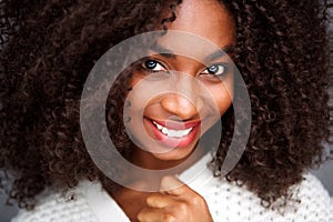 Close up portrait african american woman with curly hair wearing warm clothes