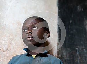 Close-up Portrait of African black Boy portrait inside of school classroom