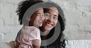 Close up portrait African mother her cute little 5s daughter