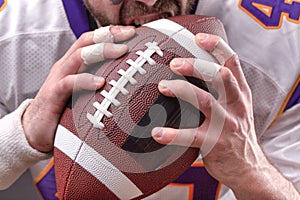 Close up portrait of aggressive American Football Player