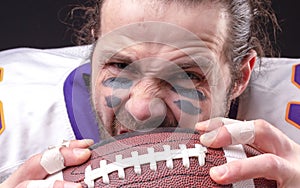 Close up portrait of aggressive American Football Player